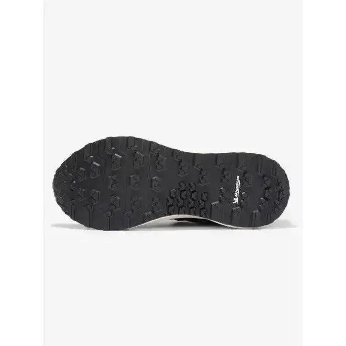 Black rubber sole of lemieux trax waterproof trainer with textured tread and michelin logo visible on the side
