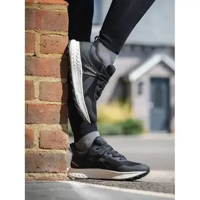 Black and white lemieux trax waterproof trainer with mesh upper and rubber sole for all-weather running