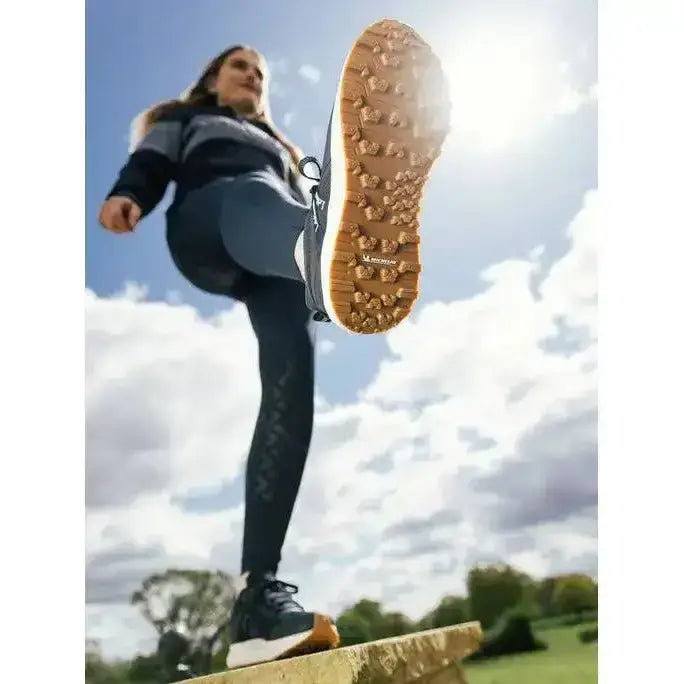 Back view of lemieux trax waterproof trainer navy with tan rubber sole and deep aggressive tread for all-terrain use