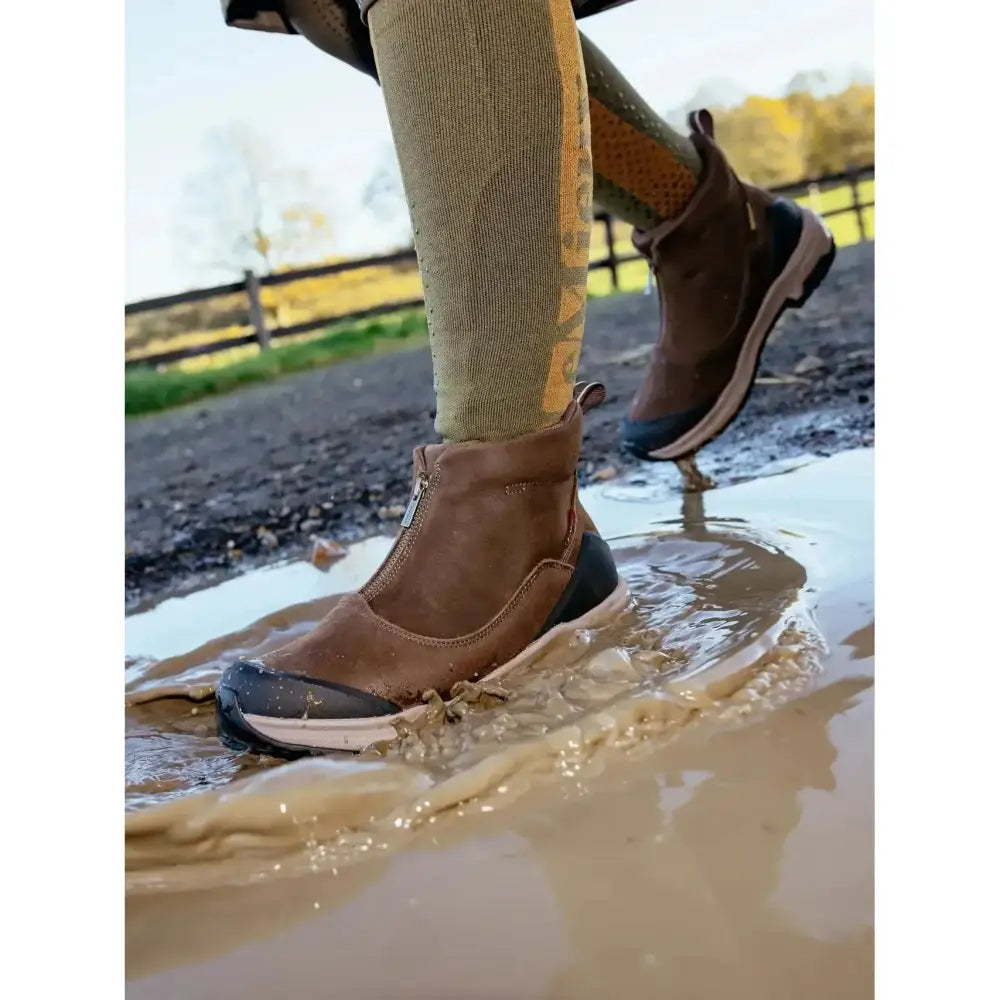 Brown suede lemieux traxion zip boots with black rubber toe cap white midsole zipper and stirrup-friendly heel