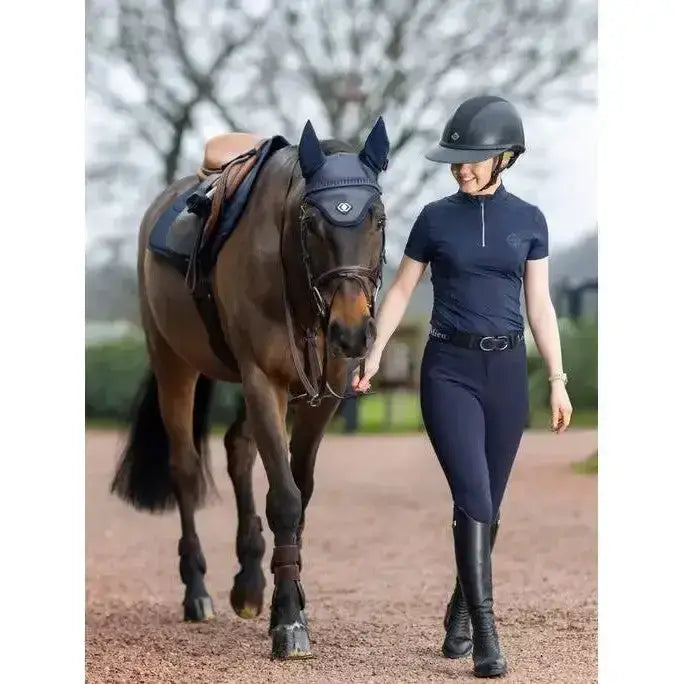 A dark navy lemieux ultra mesh equestrian helmet with a sleek finish designed for ultra mesh close contact use