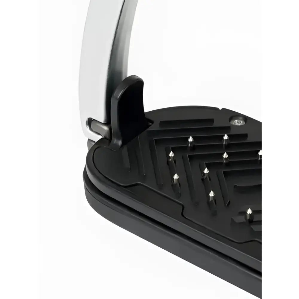 Black rubber horse stall mat with silver aviation grade aluminium lemieux vector control stirrup strap in classic style