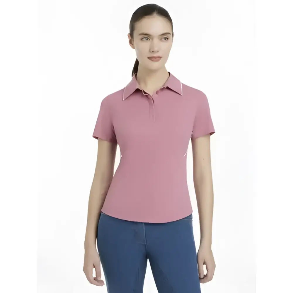 A soft pink lemieux venus performance polo with short sleeves and a classic collar perfect for riding or daily wear
