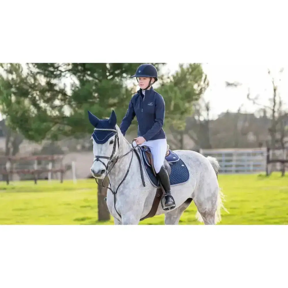 A navy blue equestrian helmet with a subtle logo similar in style to lemieux wither relief jump pad navy designs