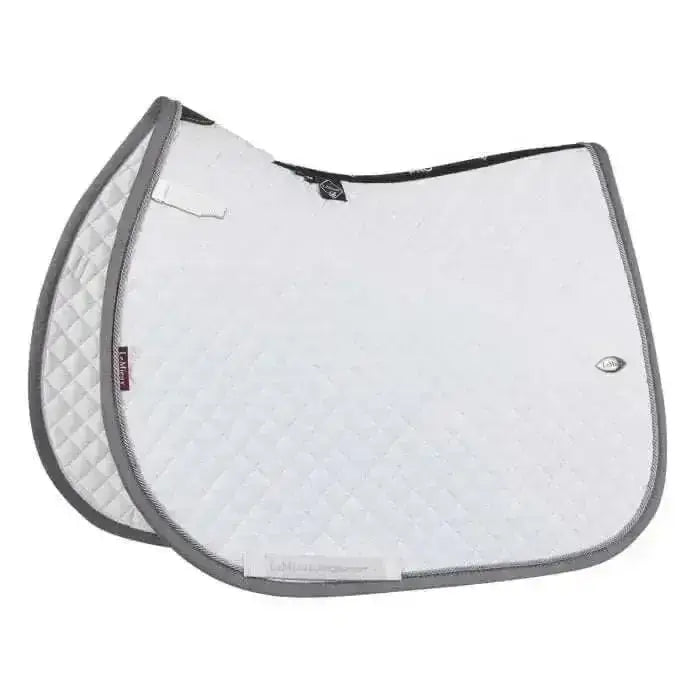 White lemieux wither relief mesh jumping pad with gray trim and diamond quilted pattern for horse saddles