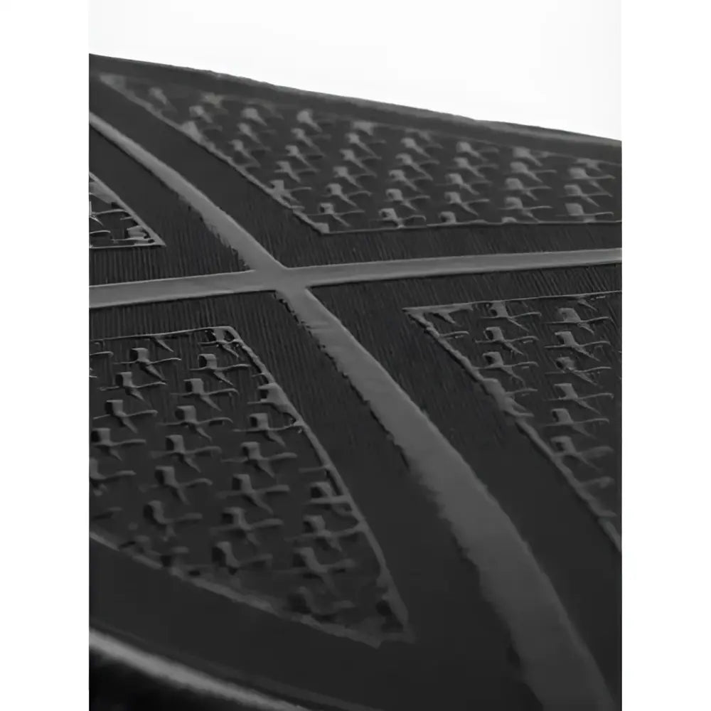 Black rubber shoe sole with textured grid tread and reinforced grooves for iconic lemieux cut silicone dressage square