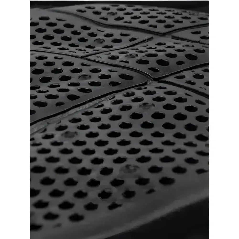 Black rubber back side of lemieux twin sided x grip dressage square navy with circular perforations for grip