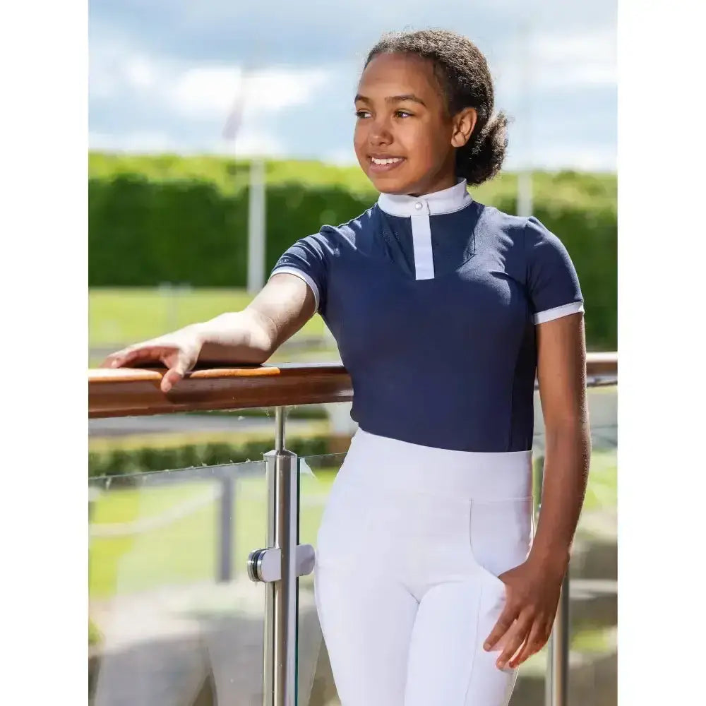 Navy blue short-sleeved lemieux young rider belle show shirt with white collar and sleeve trim in luxurious super soft fabric