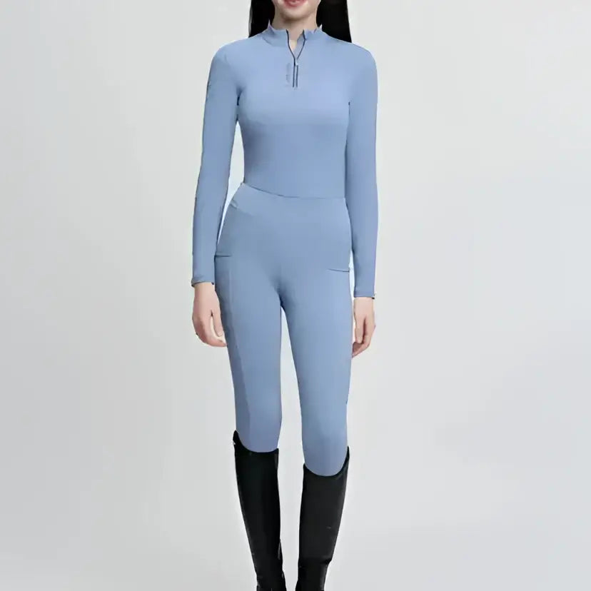 Light blue lemieux young rider classique base layer powder with high collar zipper detail for riding comfort