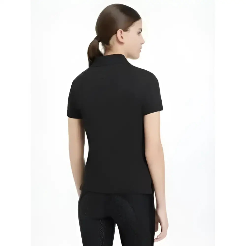 Black short-sleeved lemieux young rider classique polo shirt with classic collar and tailored fit for young rider classic style
