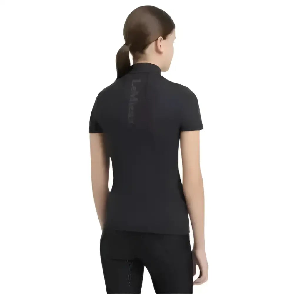 Back view of lemieux young rider classic short sleeve base layer black with high collar and subtle vertical branding