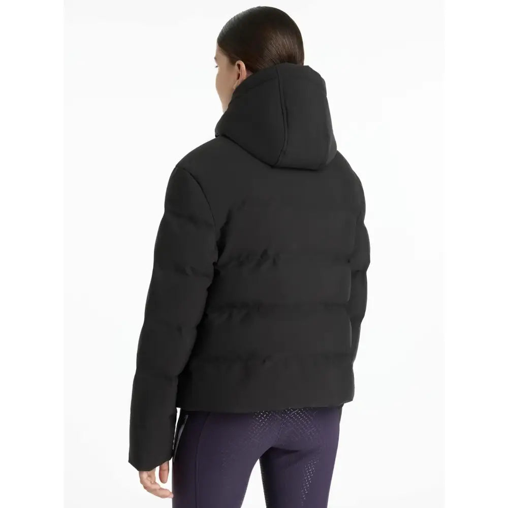 Black lemieux young rider daisy waterproof coat with hood and quilted design perfect for riding in wet weather