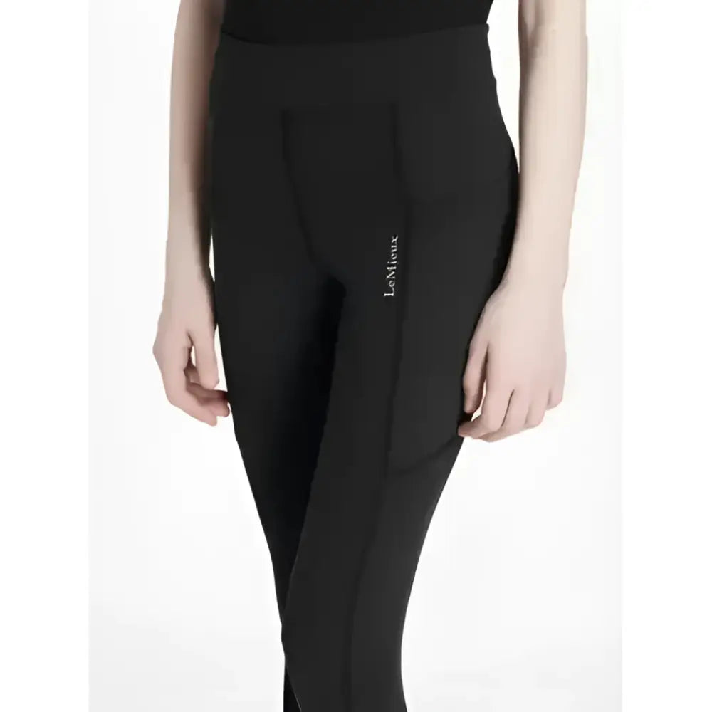 Black lemieux young rider darla sport legging with high waist and subtle vertical seam detail showing side logo
