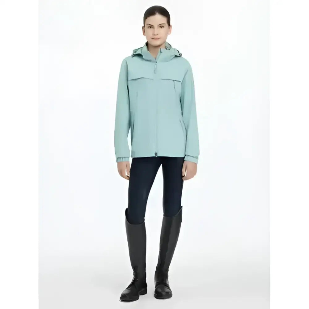 A light mint green lemieux young rider dolcie waterproof jacket with a sleek design and subtle front pockets