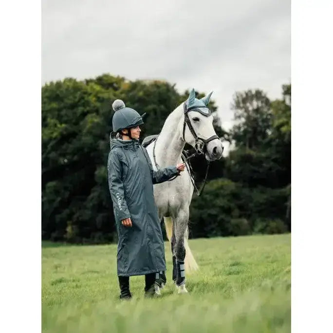 Dark gray waterproof lemieux young rider elements coat petrol with hood and subtle sleeve branding for riding
