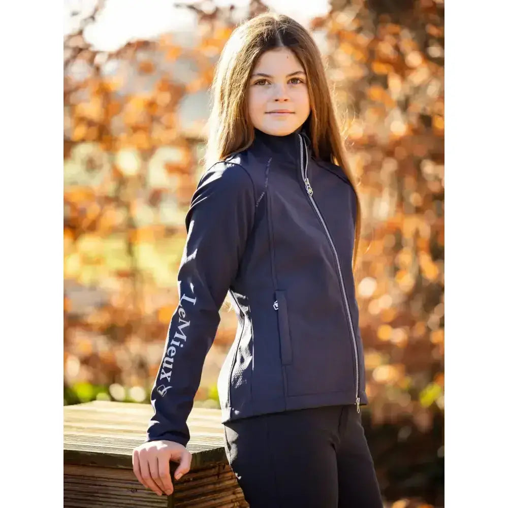 Navy blue lemieux young rider elite soft shell zip-up jacket with white sleeve lettering and silver zipper accents