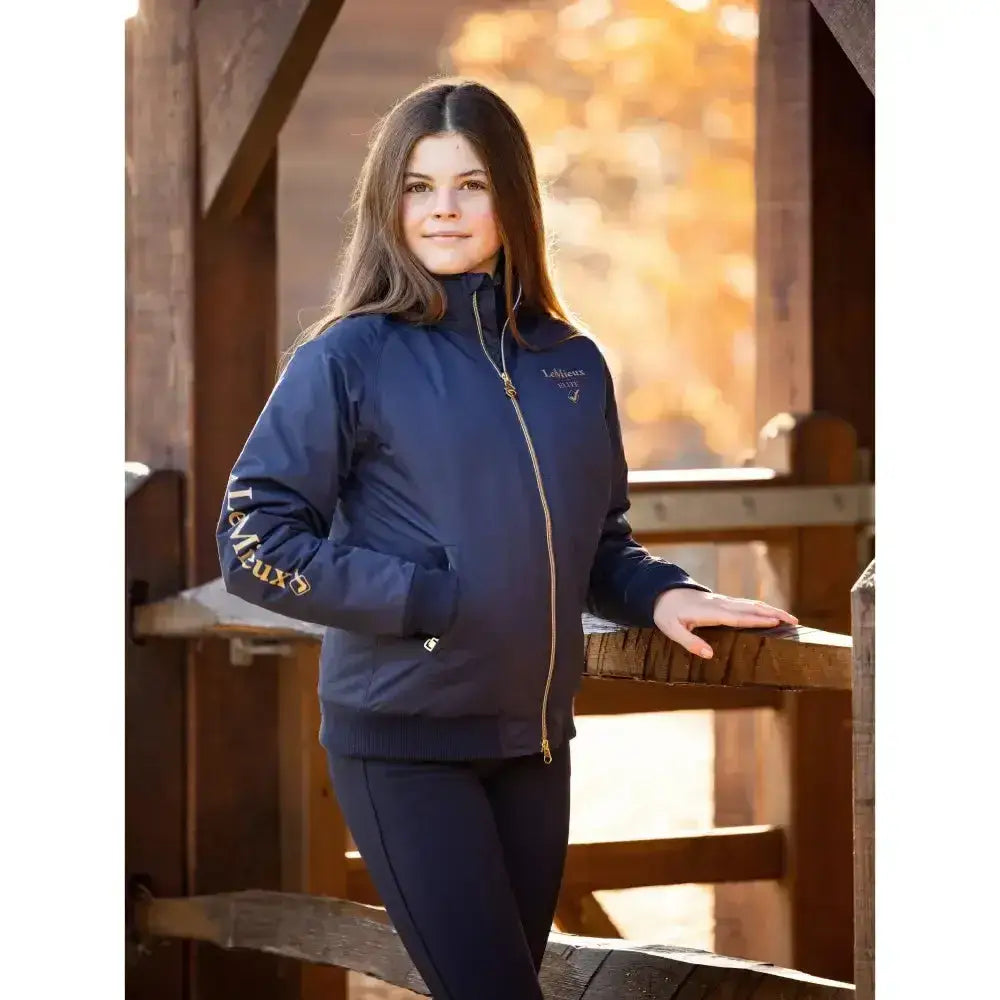 Navy lemieux young rider elite team jacket with gold zipper and embroidered branding for rider elite team use