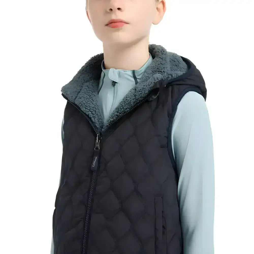 Black quilted vest with plush gray fleece-lined hood from lemieux young rider eloise reversible winter gilet navy