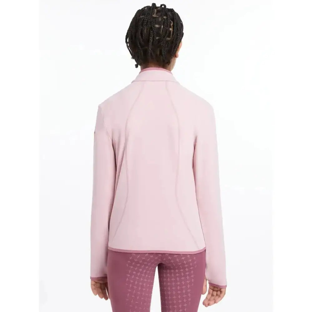 A soft pink lemieux young rider felicity fleece zip through jacket with long sleeves and high collar