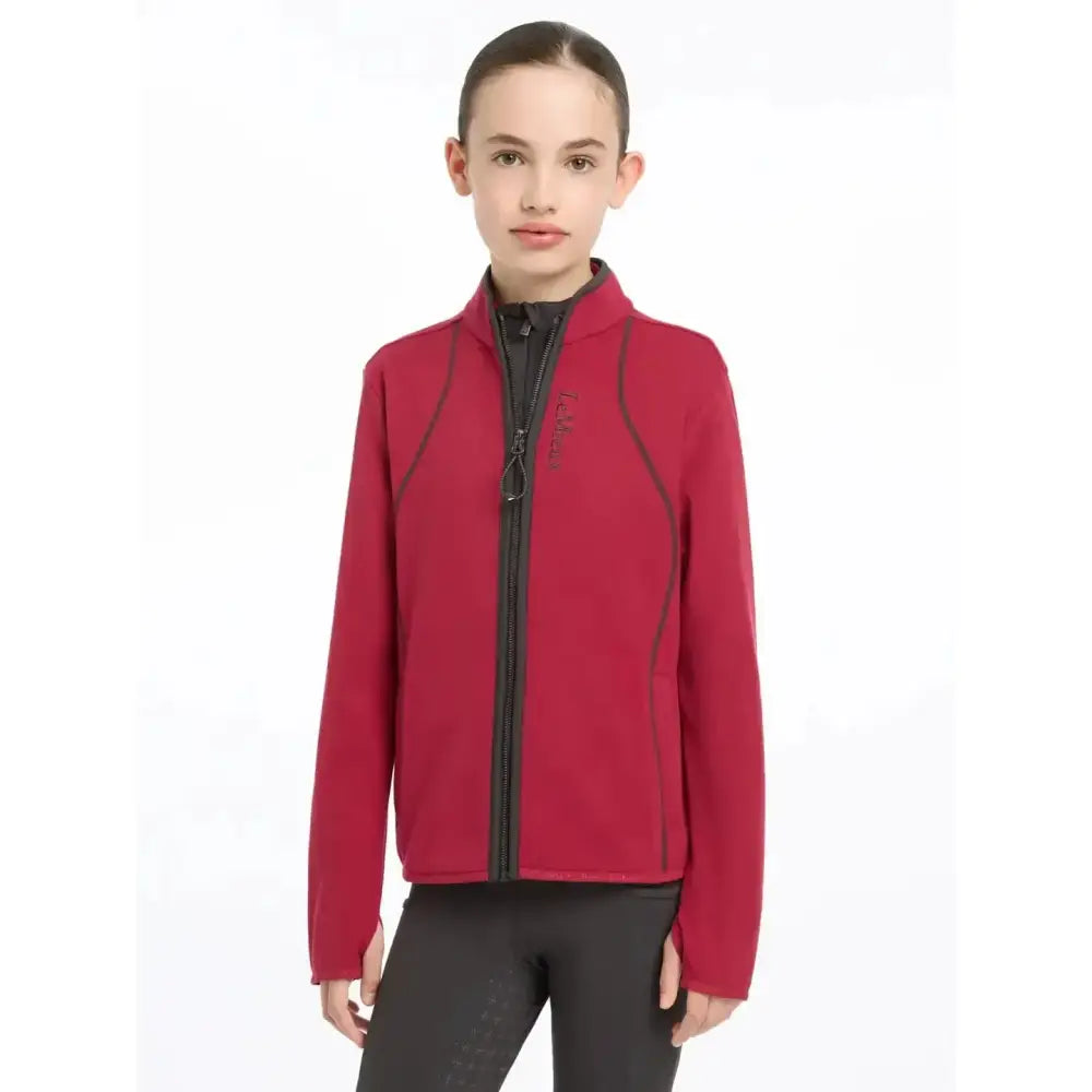 Red fleece jacket with black zipper and trim from lemieux young rider felicity fleece zip collection