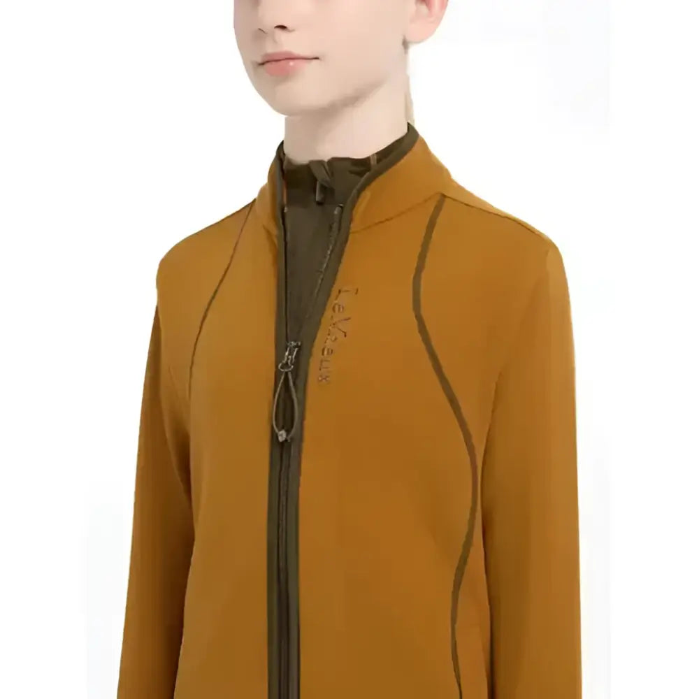 A mustard-yellow lemieux young rider felicity fleece zip jacket with dark brown trim and subtle chest logo