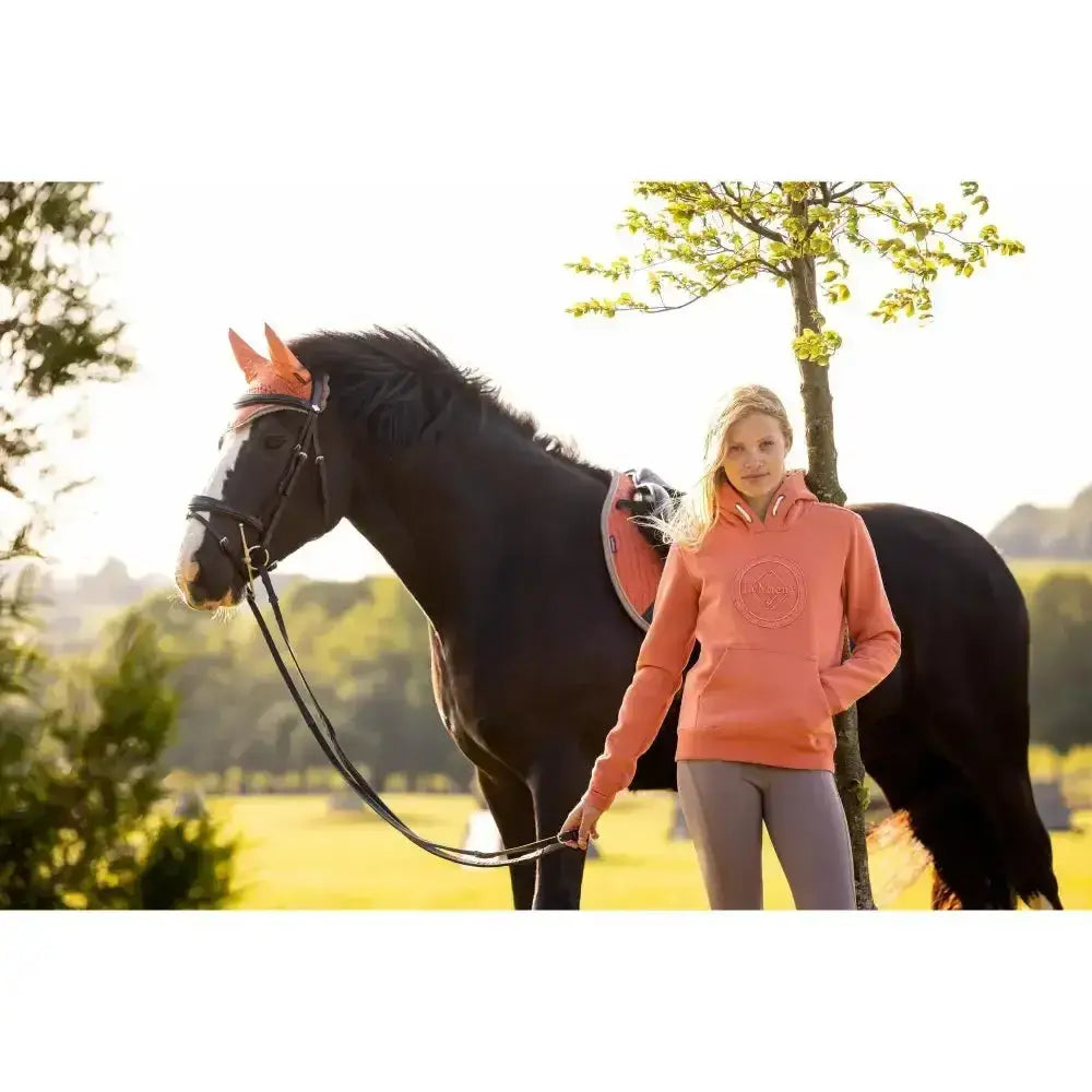 Coral-colored lemieux young rider hannah pop over apricot sweatshirt with hood and subtle circular chest logo
