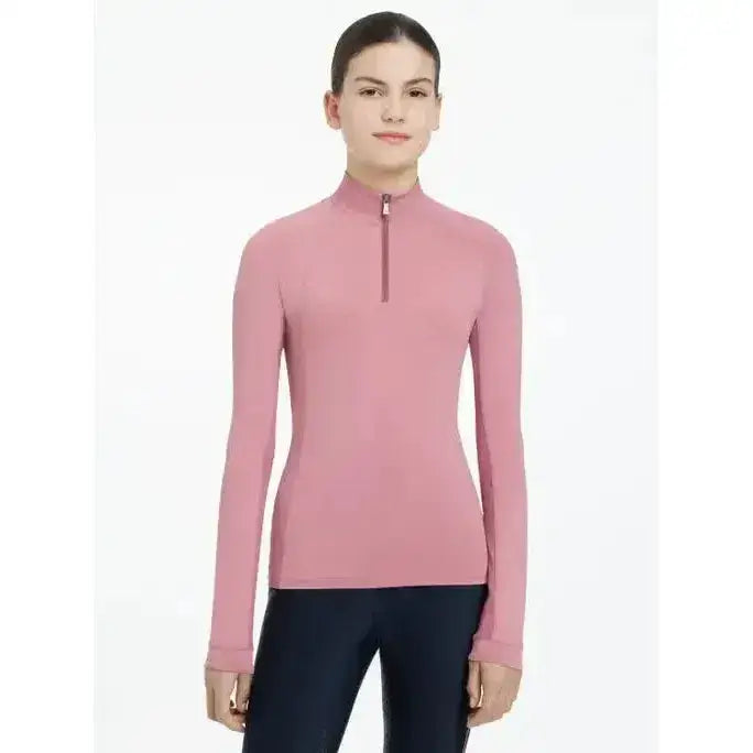A soft pink lemieux young rider hope lightweight base layer peony with long sleeves and a quarter-zip collar
