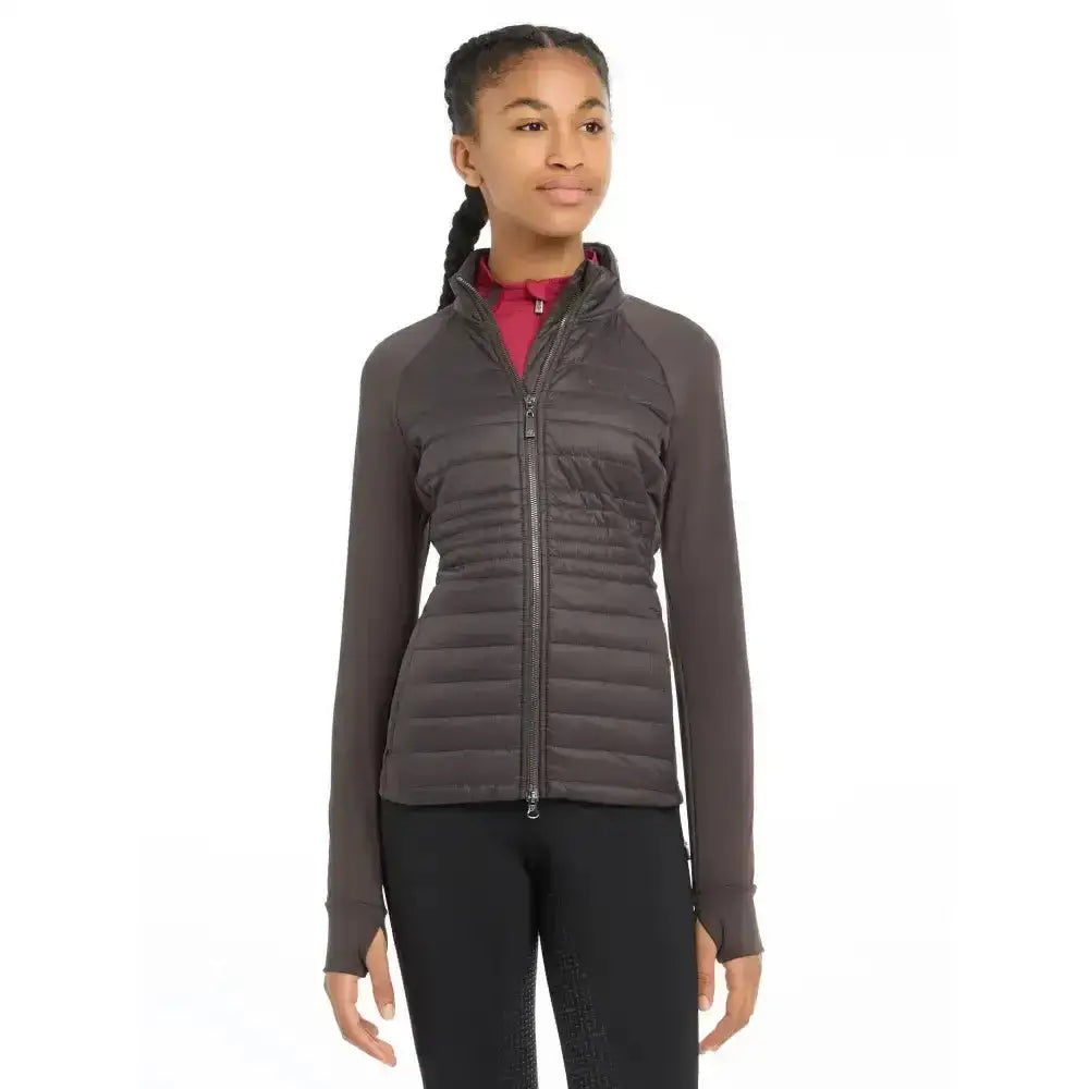 Dark gray quilted zip-up jacket with long sleeves and high collar lemieux young rider josephine jacket cinder
