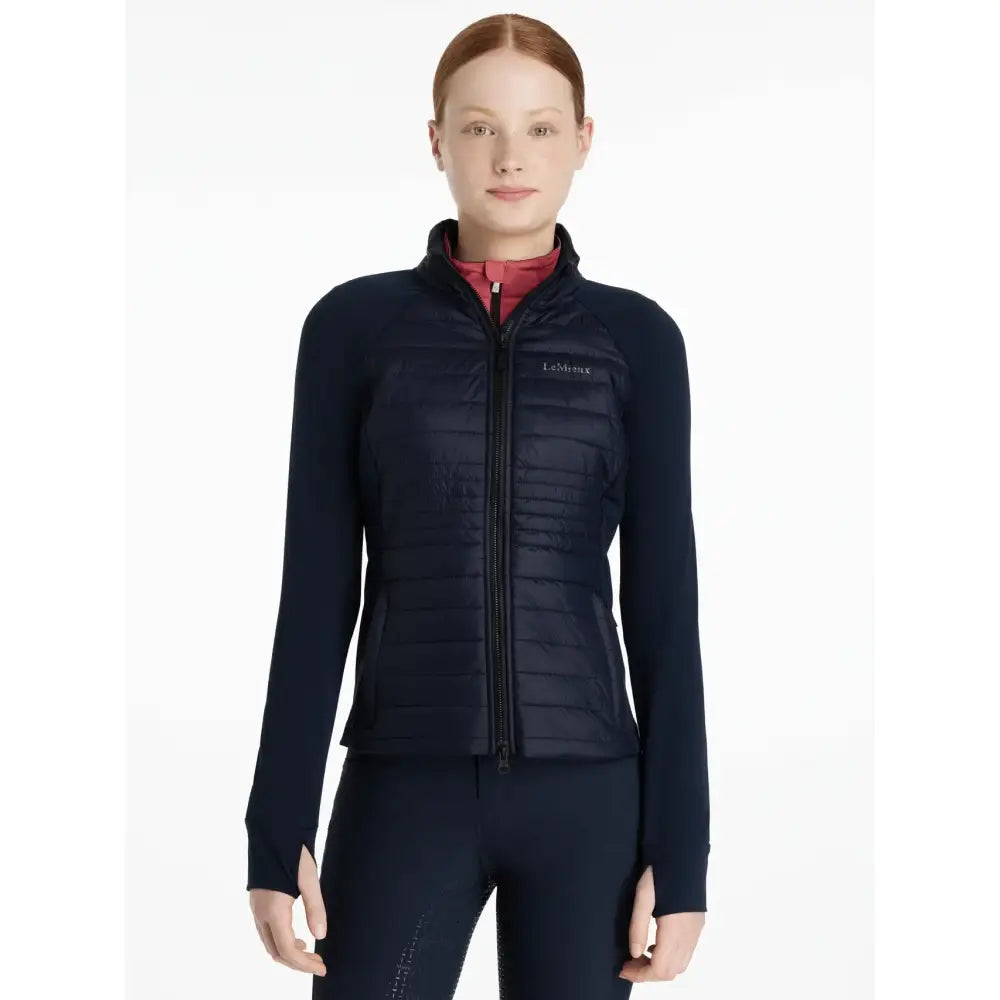 Navy blue quilted zip-up lemieux young rider josephine jacket with subtle chest logo perfect for riding
