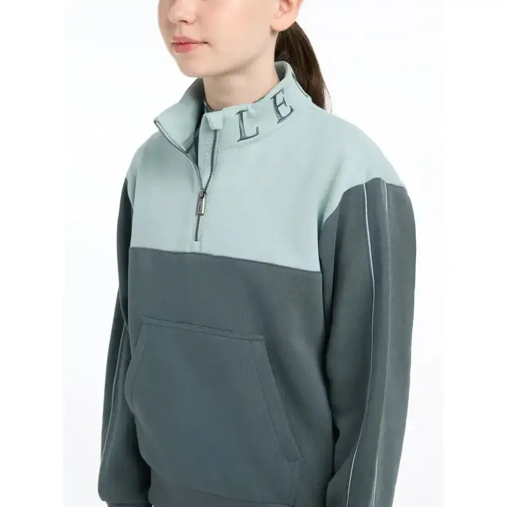 A lemieux young rider kate quarter zip fleece sweat petrol in muted sage green and charcoal gray with white piping