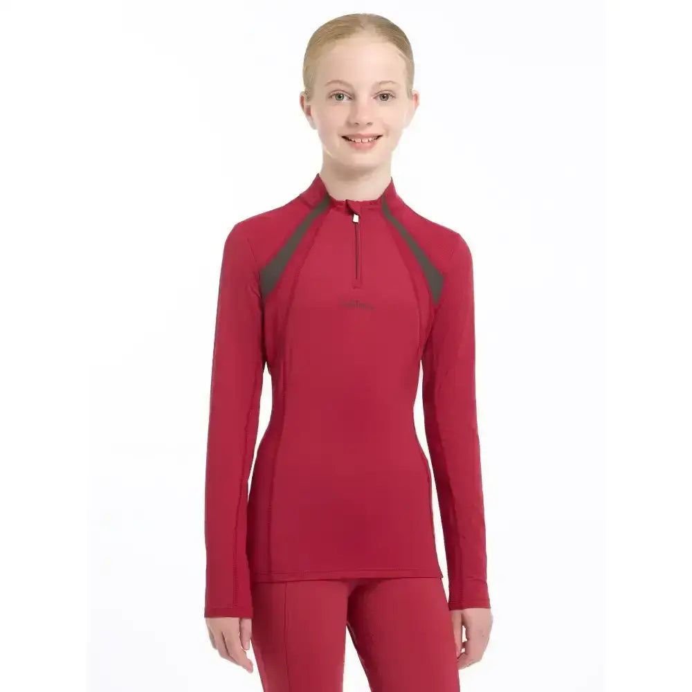 Red long-sleeved lemieux young rider mia mesh base layer with dark gray panel accents for active wear