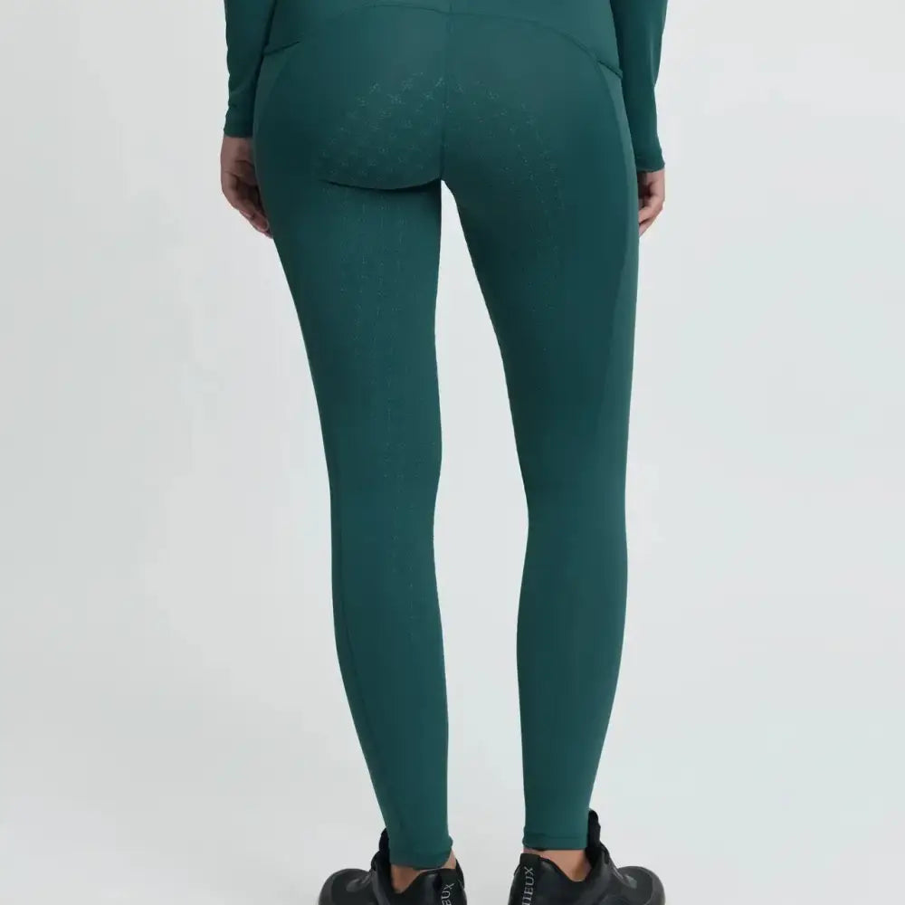 Back view of lemieux young rider breech jungle high waisted leggings in teal with smooth stretch fabric and rear pockets