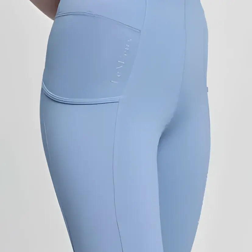 Light blue lemieux young rider orla pull breech powder blue high-waisted leggings with side pocket and subtle seams
