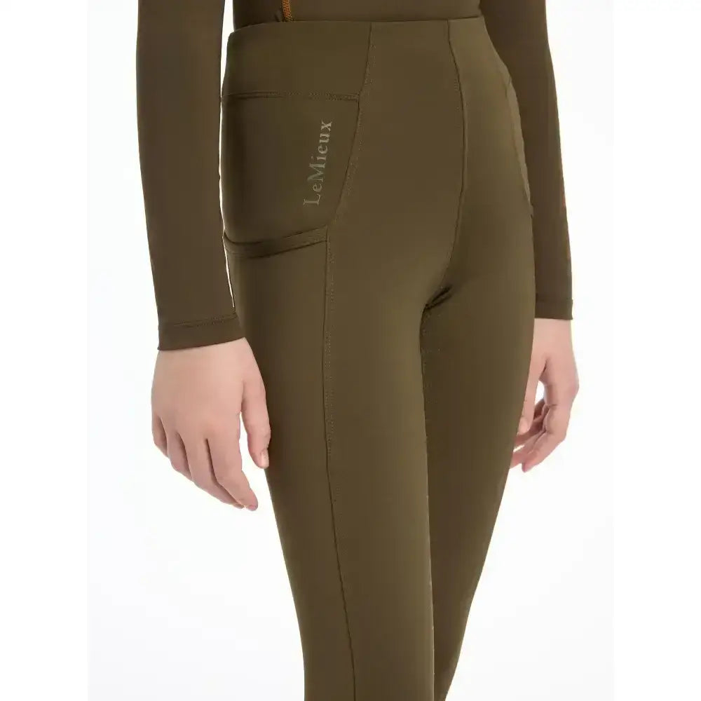Olive green lemieux young rider orla pull ons with sleek fit and subtle logo on side pocket perfect for riding