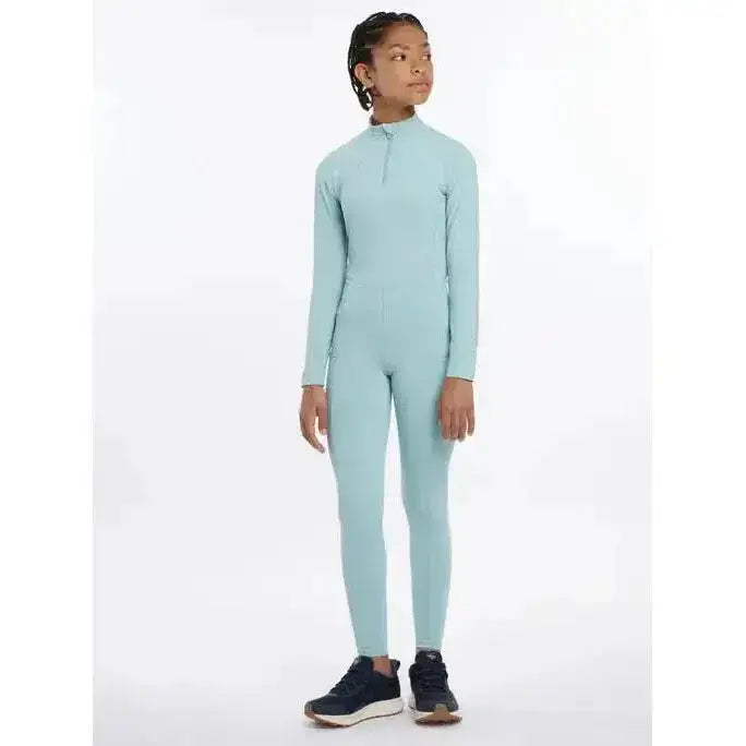 A light blue lemieux young rider orla pull ons full-body athletic suit with long sleeves and a high collar zipper front