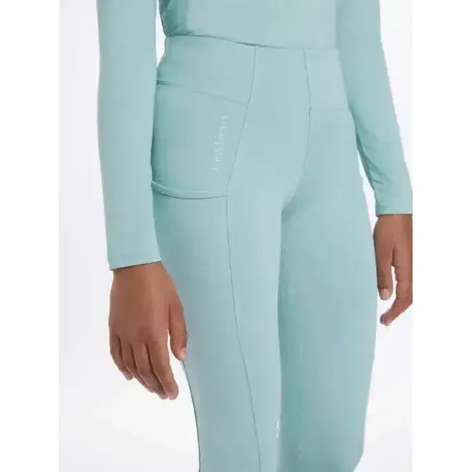 Mint green lemieux young rider orla pull ons with sleek long sleeves and subtle side seam detailing for active wear