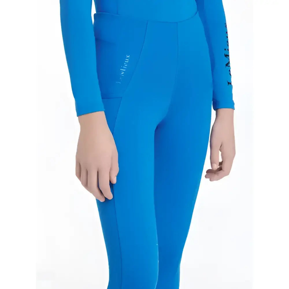 Bright blue form-fitting wetsuit pants with long sleeves and subtle logo on thigh lemieux young rider orla pull ons benetton blue