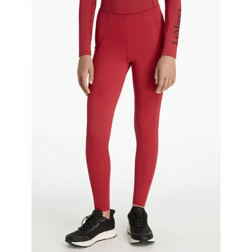 Red lemieux young rider orla pull ons leggings with high waist and subtle side pockets in chilli color