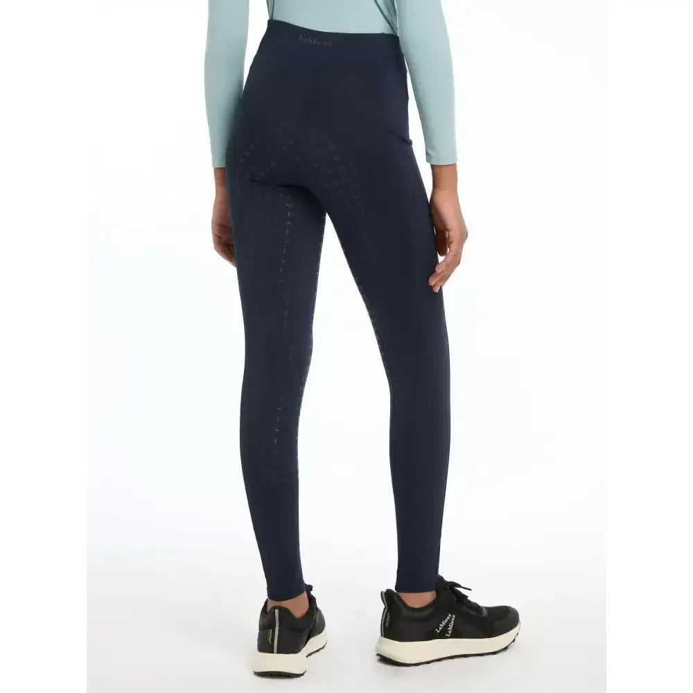 Navy blue lemieux young rider orla pull ons stretch leggings with subtle vertical stitching on outer thigh