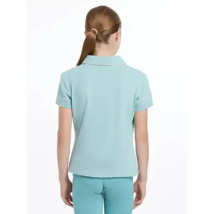 A light blue lemieux young rider polo shirt with short sleeves, collar, and subtle stitching details