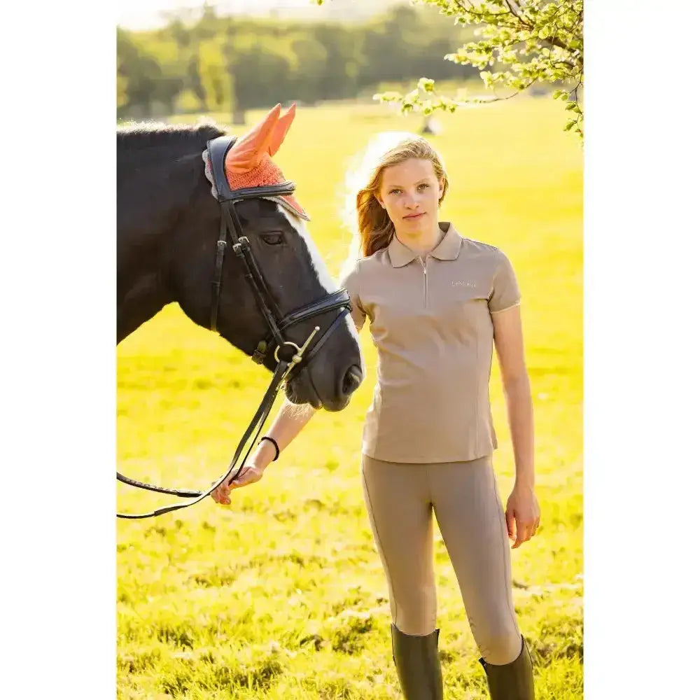 Beige lemieux young rider polo shirt with short sleeves and collar made from breathable pique fabric in mink color