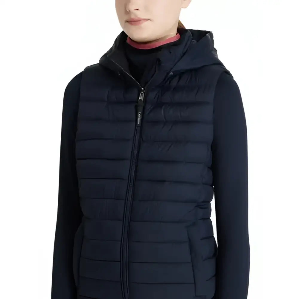 Navy blue quilted hooded vest with front zipper and side pockets lemieux young rider ruby puffer gilet