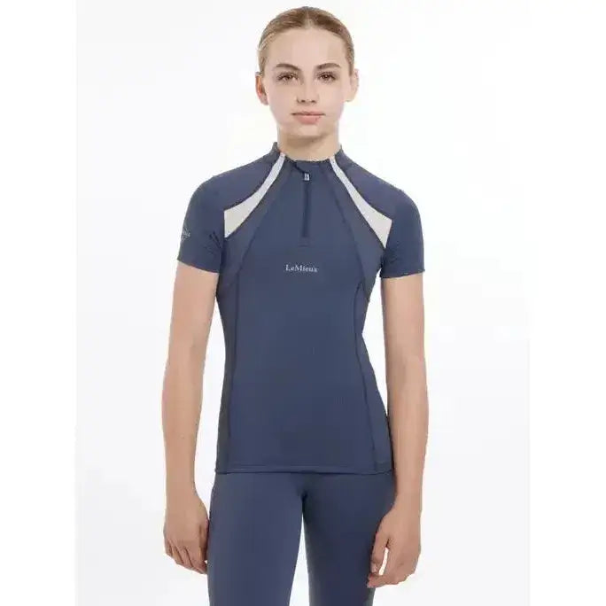 Navy blue lemieux young rider short sleeve equestrian top with white panels and half-zip mia mesh base layer in dusk blue