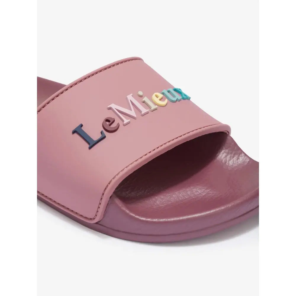 Pink lemieux young rider sliders blossom slide sandal with colorful raised lettering on the strap