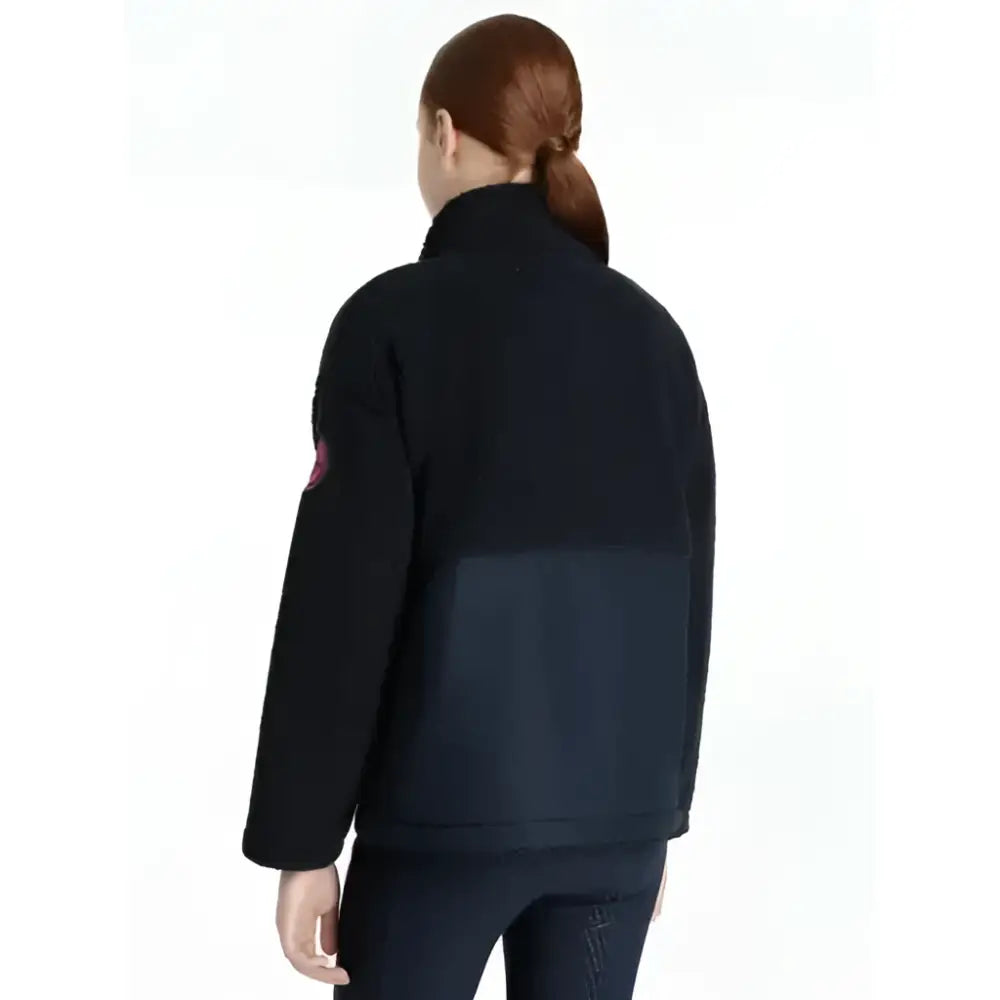 Back view of lemieux young rider tammy teddy fleece navy fleece jacket with navy panel and pink sleeve patch