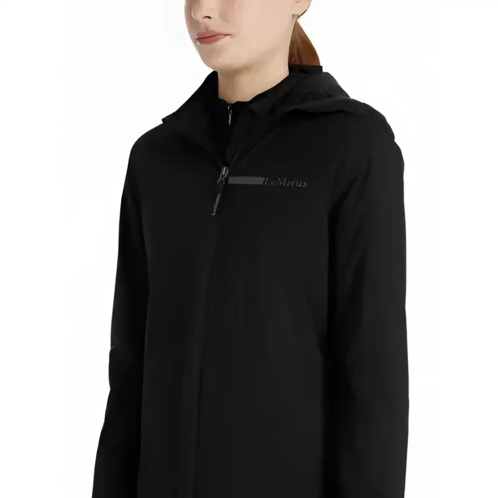 Black lemieux young rider thea water resistant jacket with a full zipper and subtle logo on the chest