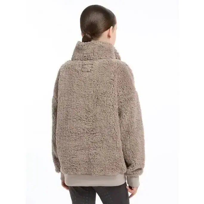 A cozy taupe lemieux young rider tia teddy fleece jacket with high collar and soft plush texture