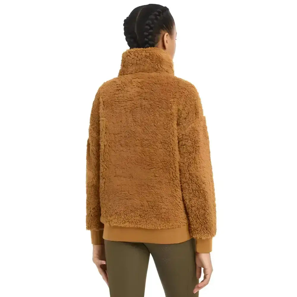 A cozy caramel-colored lemieux young rider tia teddy fleece jacket with high collar and ribbed cuffs