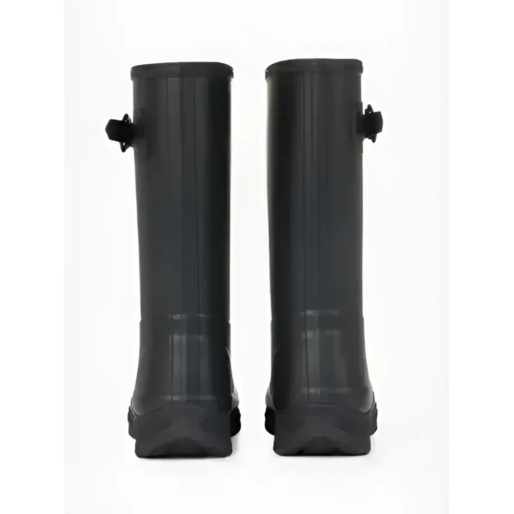 Black rubber lemieux young rider wellies black with custom tread shape sole and side buckles for sturdy grip