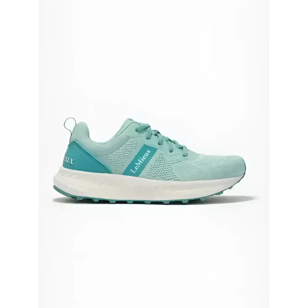 A mint green lemieux youth trainer aqua mesh running shoe with teal accents and a white sole for equestrian use